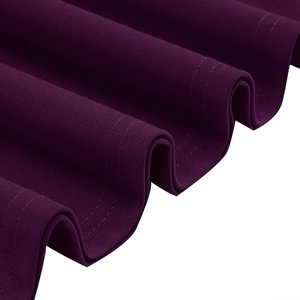 Detailed macro view of dark purple chiffon fabric with precise double-stitched hem and ruffles