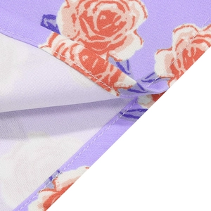 Detailed close-up of pink rose floral print fabric with high-quality flat seam stitching