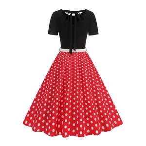 Detailed back view of vintage polka dot dress with cutout back and tie bow design