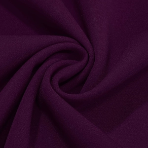 Close-up of deep purple mesh fabric with fine dotted texture and elegant draped folds