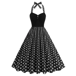 Vintage 1950s style black halter neck dress with white polka dots and heart-shaped neckline