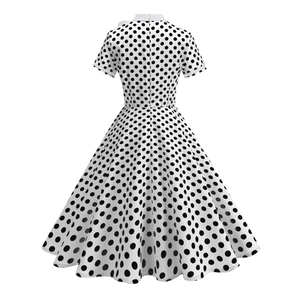 Detailed back view of a retro polka dot midi dress with white collar and tailored waistline