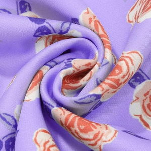 Detailed view of soft purple floral chiffon fabric with delicate rose print texture