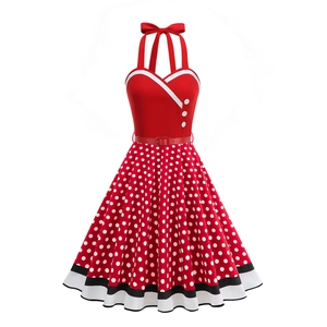Detail of red rockabilly dress featuring white polka dots and striped hemline accent