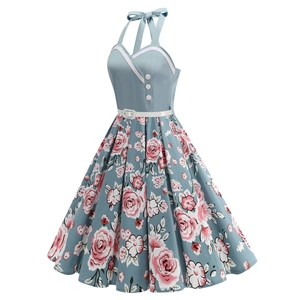 Detail of 50s vintage halter dress with polka dot buttons and floral print skirt