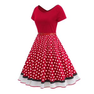 Detail of red V-neck polka dot 50s vintage dress with white dots and striped hem