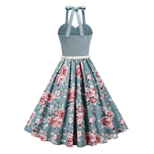 Detail of vintage floral dress with crisscross halter neck and smocked elastic back