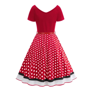 Detail of a 1950s red polka dot dress with V-neck, waist belt, and striped hem border