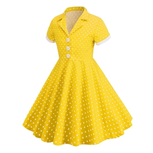 Detail of yellow polka dot vintage girls dress with V-neckline and white buttons