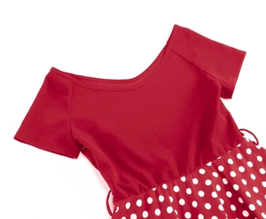 Detail of red vintage dress bodice and white polka dot skirt with retro 1950s V-neckline