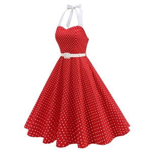Detail of a vintage red polka dot halter dress with sweetheart neck and white waist belt