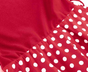 Close-up of red and white polka dot ruffle detail on a vintage cotton dress fabric