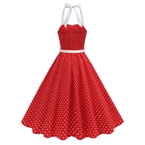Detail of red polka dot dress featuring halter neck, pleated back and thin white belt