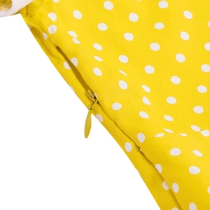 Detail of invisible zipper closure on yellow polka dot vintage girls princess dress