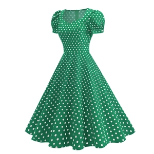 Detail of green polka dot vintage dress with sweetheart neckline and puff sleeves