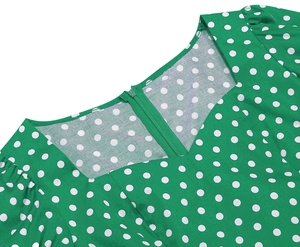 Detail of square neckline and back invisible zipper on green polka dot vintage dress