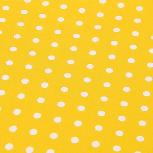 Detail von gelbem Stoff mit weißen Punkten zeigt Textiltextur und Musterung