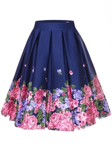Detailed macro view of vintage floral print and pleated texture on a navy satin skirt