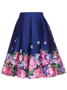Detailed view of dark blue satin skirt with pleated waist and rose floral print