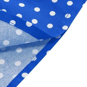 Detailed close-up showing the double-stitched hem and blue polka dot fabric texture