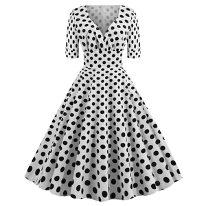 Abito vintage a pois bianchi con scollo a V e gonna a ruota stile Audrey Hepburn