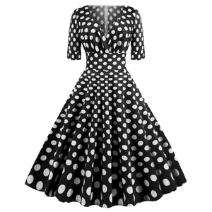 Abito a trapezio vintage a pois con scollo a V, vita alta e maniche corte in nero e bianco