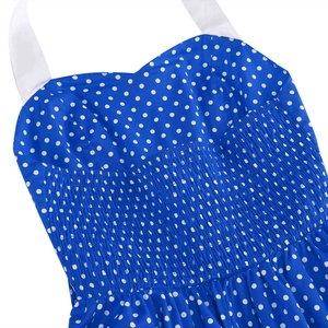 Detail view of elastic smocking craft on blue polka dot dress with halter neck strap