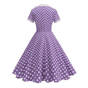 Detail view of the vintage purple polka dot dress back with a cinched waist and flared hem