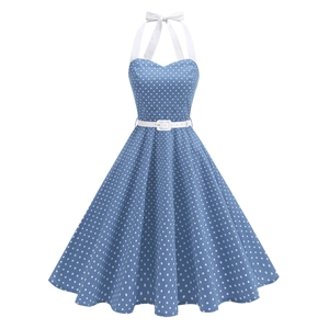 Detailed view of vintage blue polka dot swing dress with halter neck and white waist belt
