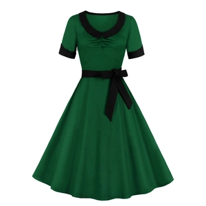 Elegant 1950s vintage dark green dress with black collar and a waist-slimming bow belt