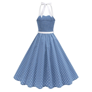 Detailed view of blue polka dot dress with halter neck, white bow and slim waist belt