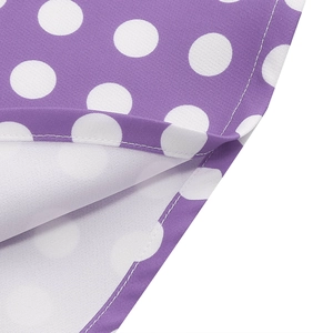 Close-up of purple white polka dot dress showing high-quality fabric texture and stitching