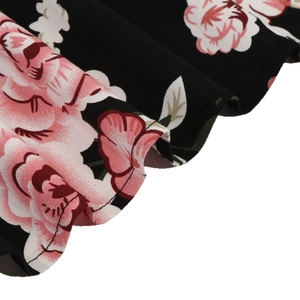 Vintage V-neck dress featuring realistic pink roses and white floral print on black fabric