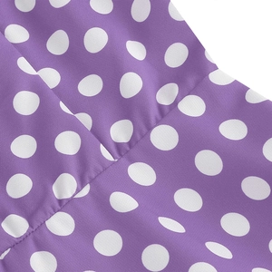 Close-up detail of purple polka dot fabric with high-quality stitching and texture