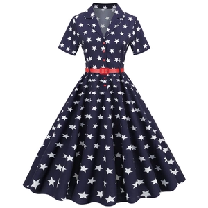 Vintage navy rockabilly dress with white stars, red belt and A-line swing silhouette