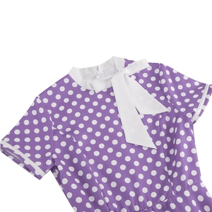 Detail of purple polka dot dress featuring white collar and bow tie neckline