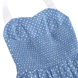 Detail of blue polka dot dress featuring sweetheart neckline and smocked bodice texture