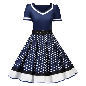 Detail of vintage navy blue polka dot dress with V-neckline and retro waist belt