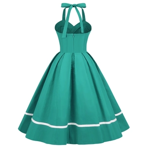 Detail of a vintage 1950s teal halter neck dress featuring white stripes on the hemline
