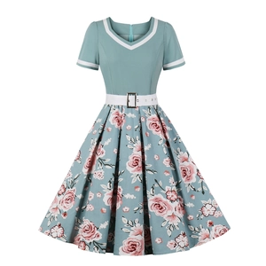 Vintage 50s floral puff dress with V-neckline and pink rose patterns on a flared skirt