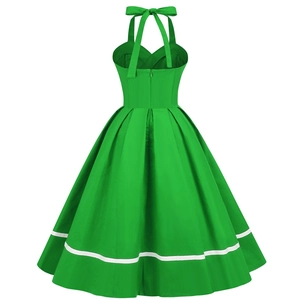 Detail of emerald green vintage halter dress showing back zipper and flared A-line hem