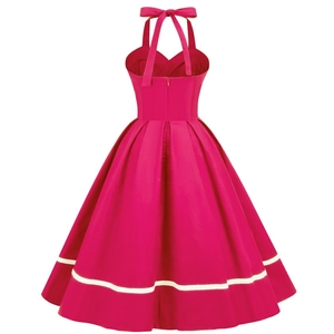 Rear view of a 1950s style pink halter dress showing the bow tie and contrast stripes