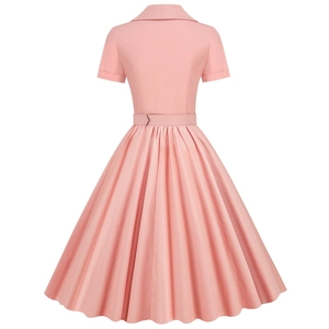 Back view of a pink vintage A-line dress with short sleeves and a pleated flared skirt