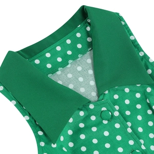 Retro green sleeveless dress with white polka dots and classic lapel collar detail