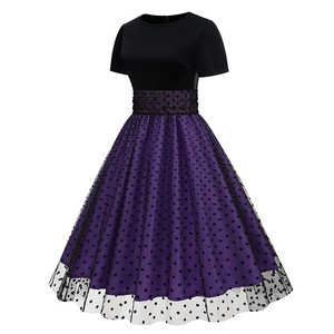 Detail of retro Hepburn dress featuring a black bodice and purple polka dot mesh skirt