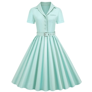 Detail of mint green vintage dress showing notched lapels, buttons, and matching belt