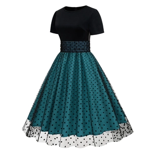 Detail of retro polka dot mesh skirt with pleated waist on vintage Hepburn dress