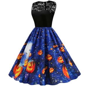 Detail of lace stitching and Halloween pumpkin prints on a sleeveless flared dress