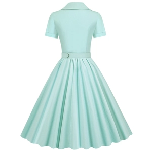 Back view of mint green retro dress with short sleeves and a pleated circle skirt