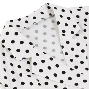 Close-up of lapel collar on white polka dot sleeveless vintage Audrey Hepburn dress